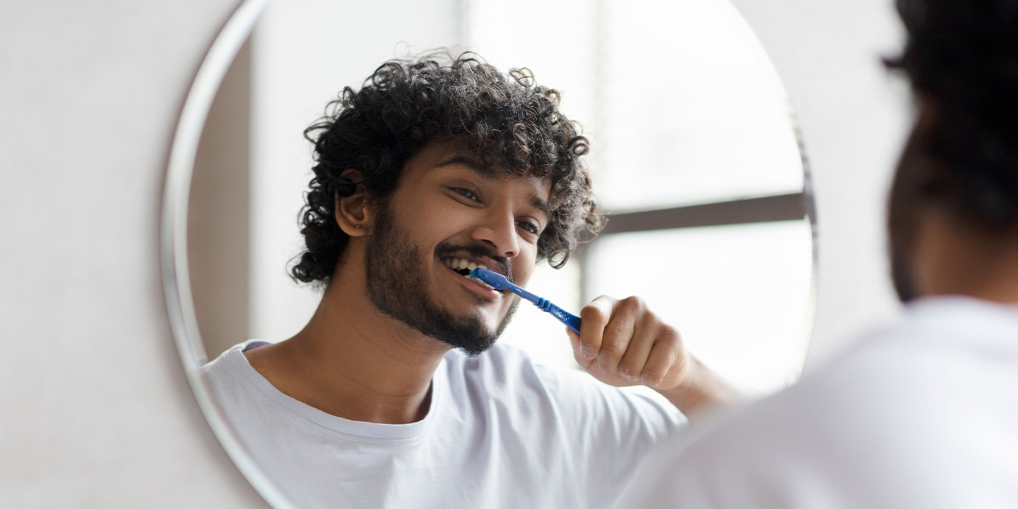 Man shaking their teeth