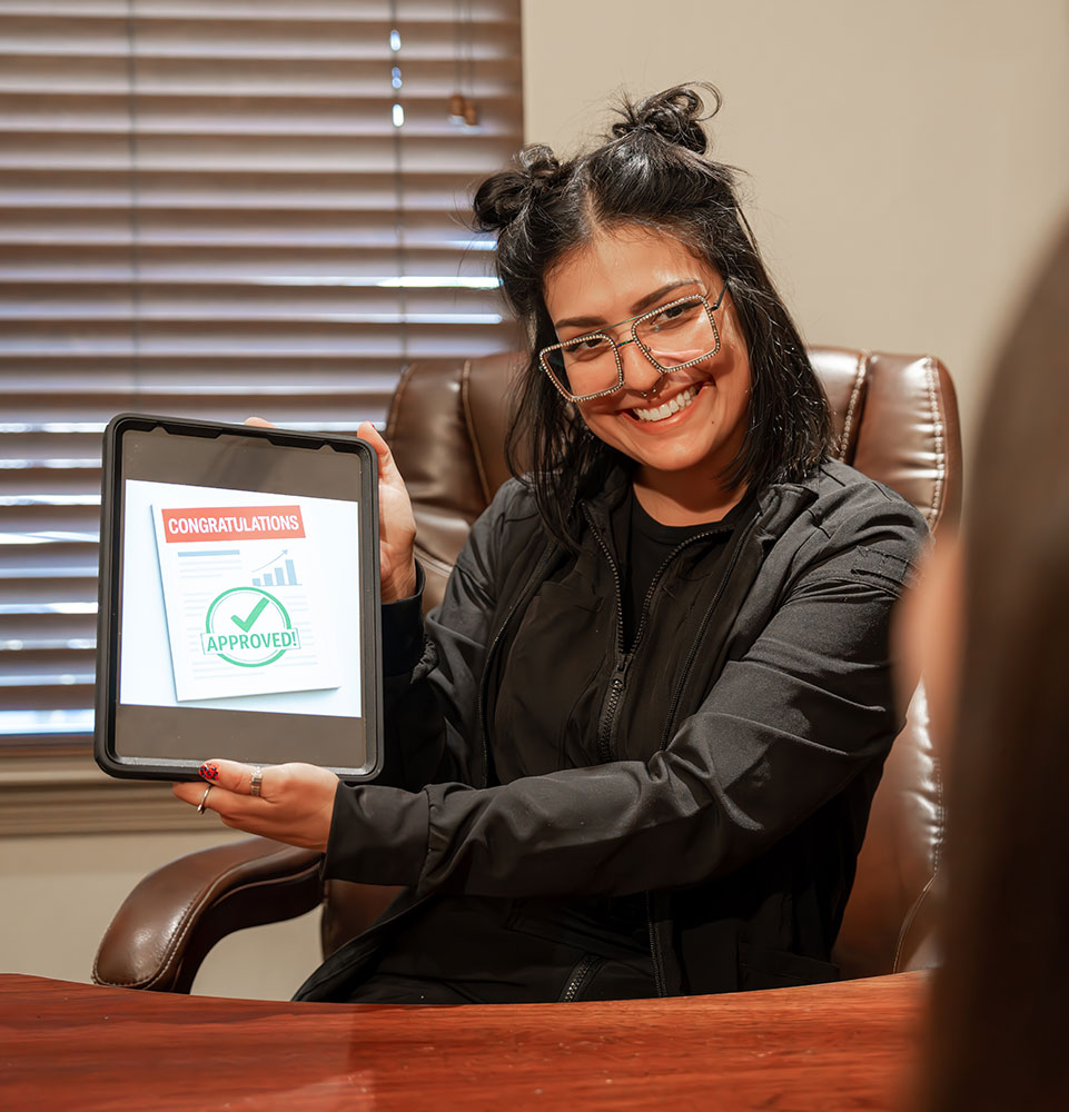 Team member holding up tablet