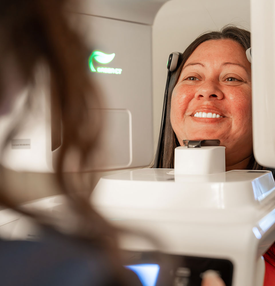 Patient Smiling taking a dental x-ray