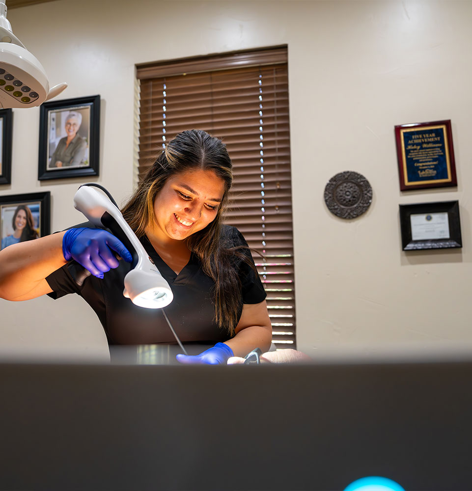 Team member taking photos of Patients mouth