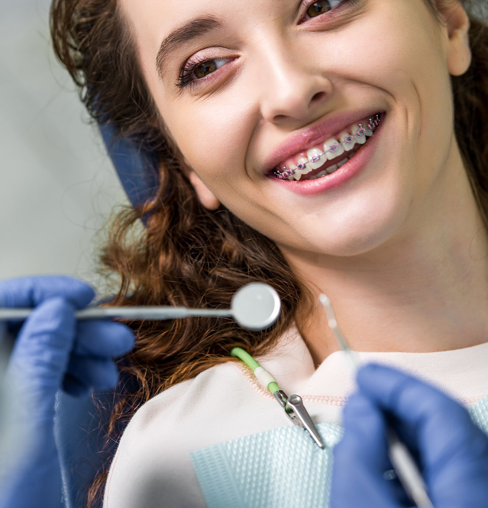 Doctor checking on Patients braces